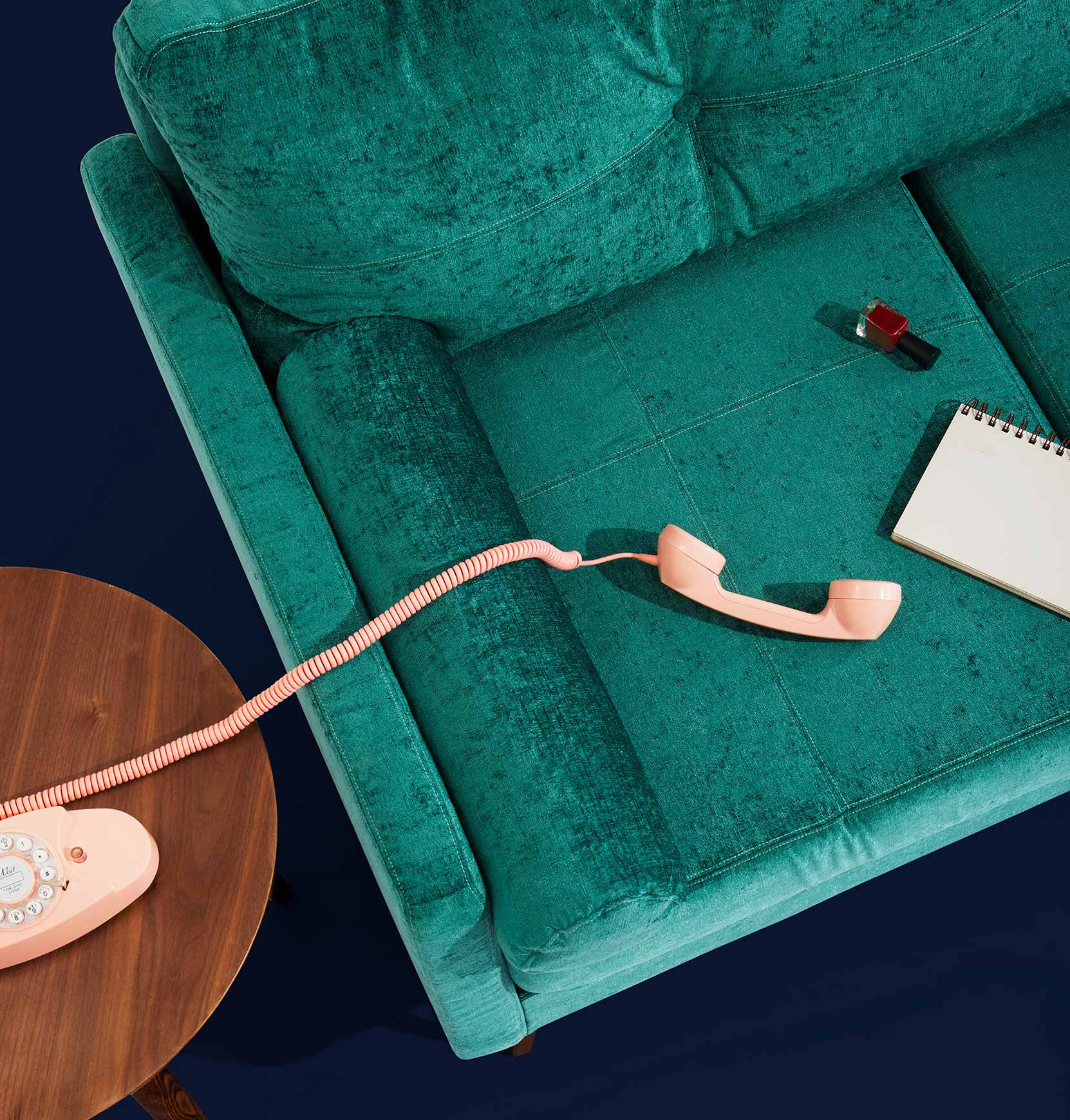 Effortless Estate Solutions – Schedule Your Consultation Today Smartphone and notebook resting on a modern couch, symbolizing seamless estate planning, consultations, and expert estate services.