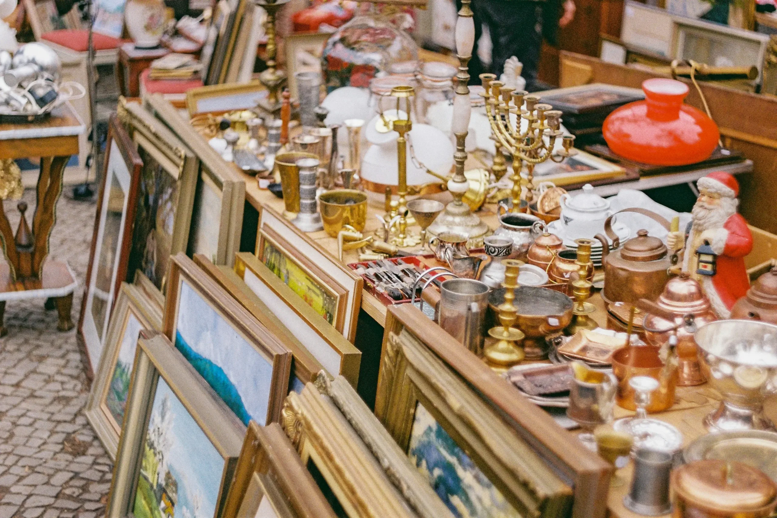 A collection of vintage and antique items displayed at an estate sale managed by Messina & Park, featuring fine collectibles, art, and home décor for buyers and collectors.